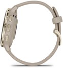 Zijprofiel van een lichtbruine smartwatch met gouden accenten.