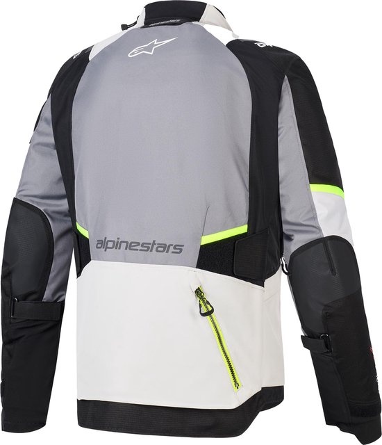 Motorjas van Alpinestars met grijze, lichte grijze en zwarte panelen, fluo-gele rits en accenten.