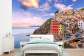 Behang - Fotobehang Uitzicht op Riomaggiore in de Cinque Terre. - Breedte 420 cm x hoogte 280 cm