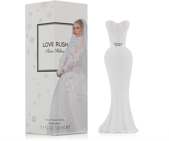 Love Rush parfumfles in witte trouwjurkvorm naast de doos met Paris Hilton in een bruidsjurk.