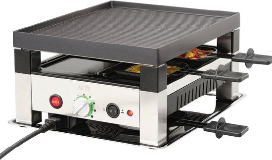 Compacte zilverkleurige raclette grill met pannetjes met eten erin, op een tafel met een kerstversiering.