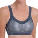 Grijze sportbeha met opengewerkte zilverkleurige cups, brede band en verstelbare bandjes.
