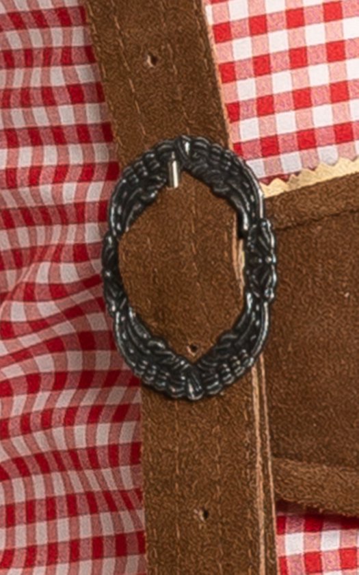 Détail de la boucle métallique sur la bretelle de la culotte de leder brune.
