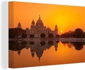 Canvas Schilderij Oranje zonsondergang in de Indiase stad Calcutta - 30x20 cm - Wanddecoratie