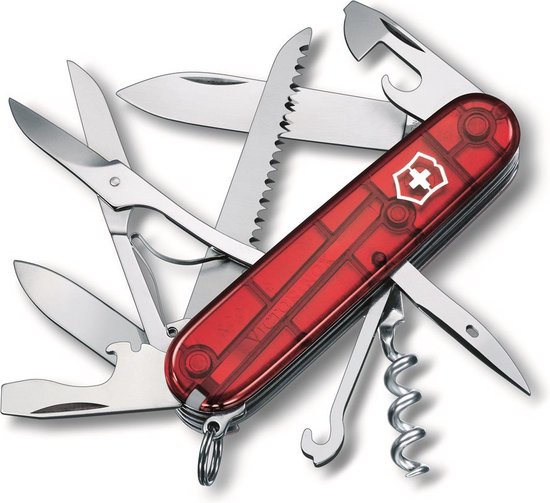 Couteau suisse Victorinox rouge transparent déplié avec divers outils tels qu'une lame et des ciseaux.