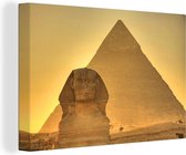 Canvas Schilderij De Sfinx van Gizeh in het avondlicht in Egypte - 90x60 cm - Wanddecoratie