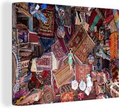 Canvas schilderij 160x120 cm - Wanddecoratie Vrouw ligt op Turkse tapijten - Muurdecoratie woonkamer - Slaapkamer decoratie - Kamer accessoires - Schilderijen