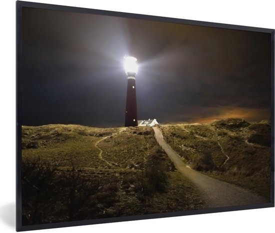 Fotolijst incl. Poster - Een verlichte vuurtoren op het eiland Schiermonnikoog - Posterlijst