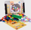 Plus-Plus BIG opbergbox vol bouwstenen. Deksel toont meisje met regenboog. Inclusief instructies.