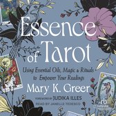 Boekomslag Essence of Tarot met illustraties van tarotkaarten, bloemen en een vogel op een blauwe achtergrond.
