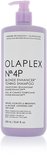 Lichtpaarse fles met pompdispenser, met daarop 'OLAPLEX N°.4P BLONDE ENHANCER TONING SHAMPOO'.