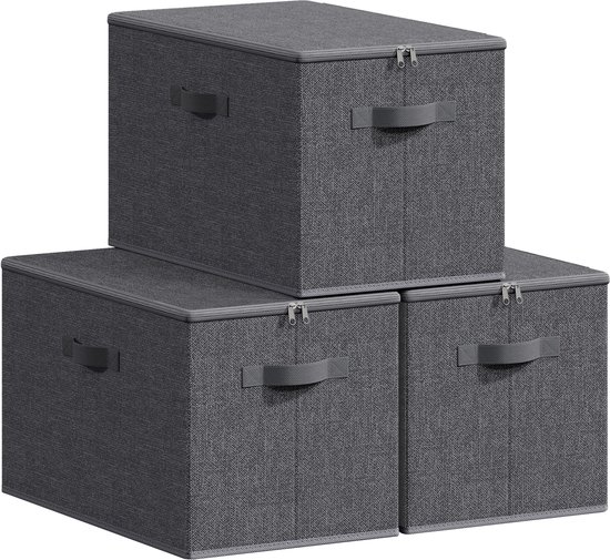 Trois boîtes de rangement en tissu gris foncé avec couvercle et poignées, empilées.