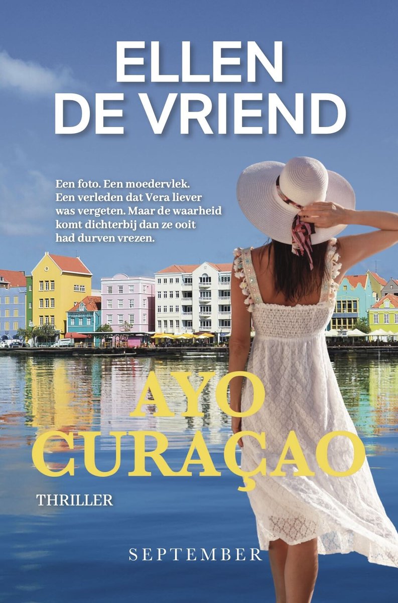Boekcover 'Ayo Curaçao' door Ellen de Vriend. Een vrouw met een grote witte hoed staat met haar rug naar de kijker, kijkend naar kleurrijke gebouwen aan het water. Getiteld 'Ayo Curaçao Thriller'.