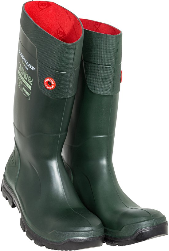 Paar donkergroene Dunlop werklaarzen met rode voering en zwarte zolen.