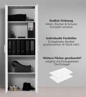 Grijze kast met betonlook, open interieur met planken, mappen, boeken en schoenen.