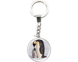 Deluxebase Magnidome Sleutelhanger Pinguïn Betoverende kristallen sleutelhanger met pinguïnillustratie in koepelvorm met roestvrijstalen ketting