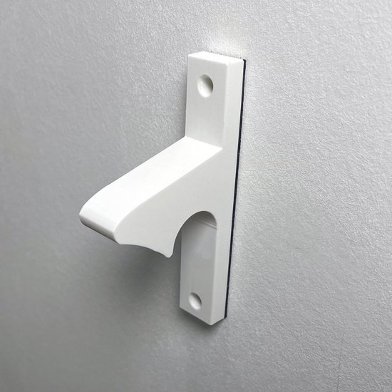 Witte deurvastzetter met een T-vormig profiel, gemonteerd op een grijze muur.