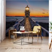 Fotobehang Lighthouse At Sunset | VEL - 152.5cm x 104cm | 130gr/m2 Vlies