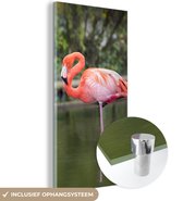 MuchoWow® Glasschilderij 60x120 cm - Schilderij acrylglas - Een flamingo staat op een poot in het water - Foto op glas - Schilderijen
