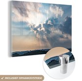 MuchoWow® Glasschilderij 180x120 cm - Schilderij acrylglas - Dramatisch licht en wolken boven zee - Foto op glas - Schilderijen