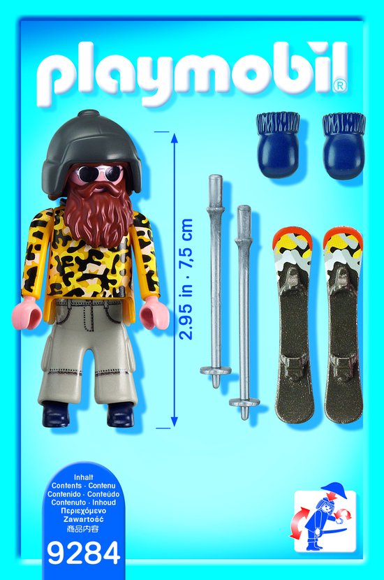 Playmobil skiër met baard, skibril, gele jas met luipaardprint en beige broek, inclusief ski's, stokken en blauwe wanten.
