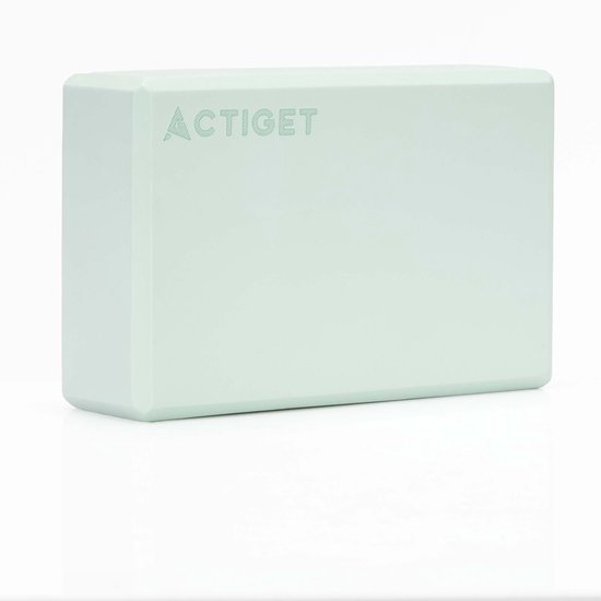 Un bloc de yoga Actiget vert clair sur fond blanc.