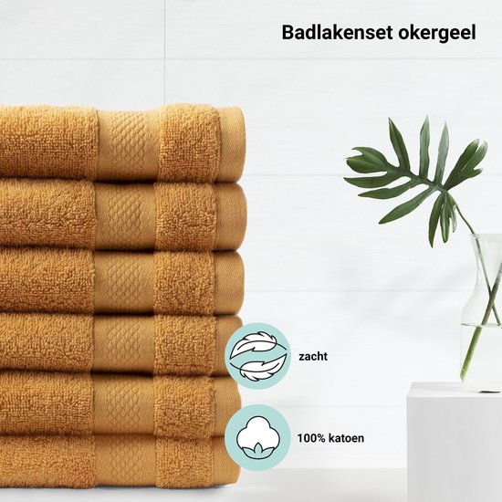 Pile de serviettes ocre avec bordure brodée, avec des icônes douces et 100% coton.