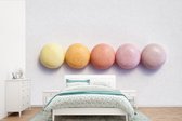 Behang - Fotobehang Pastelkleurig snoepgoed - Breedte 525 cm x hoogte 350 cm