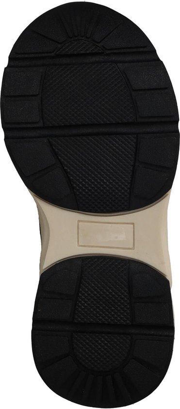 Zool van een zwarte sneaker met beige en zwart profiel.