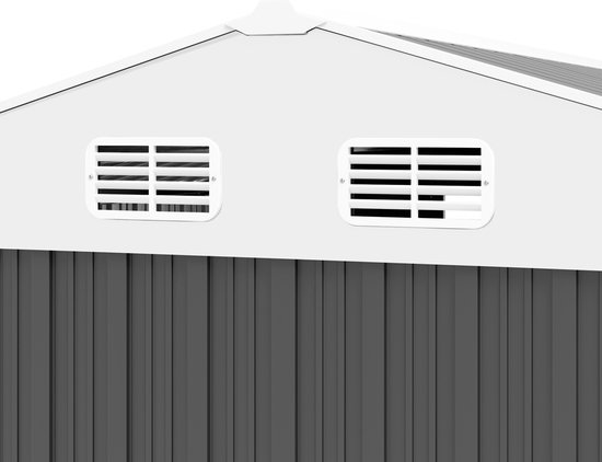 Detail van de ventilatieroosters aan de voorzijde van een donkergrijs metalen tuinhuis.