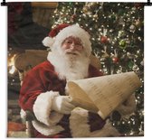 Wandkleed Kerst - De Kerstman controleert zijn lijst Wandkleed katoen 150x150 cm - Wandtapijt met foto