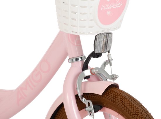Roze fietsframe met witte mand en remhendel.
