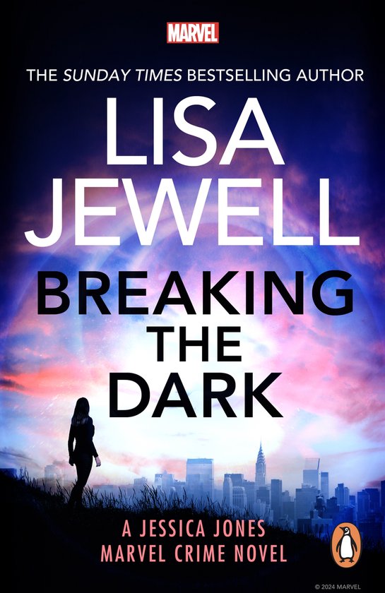 Livre 'Breaking the Dark' de Lisa Jewell avec une silhouette de femme devant une ville au coucher du soleil.