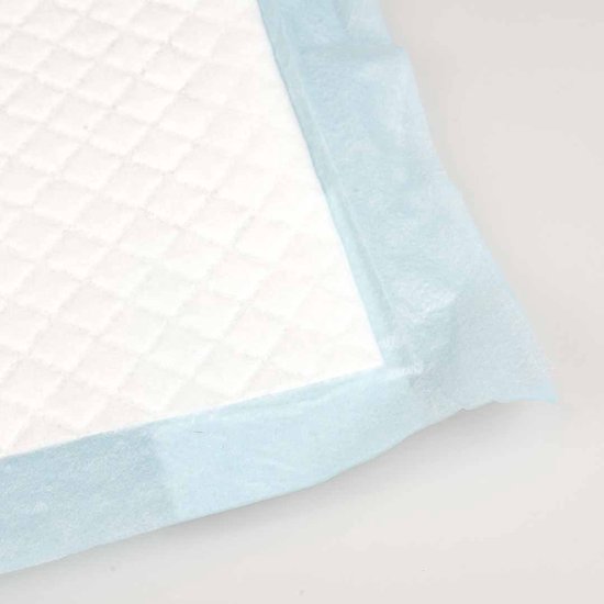 Detail van een blauw absorberend kussen met een wit ruitpatroon.