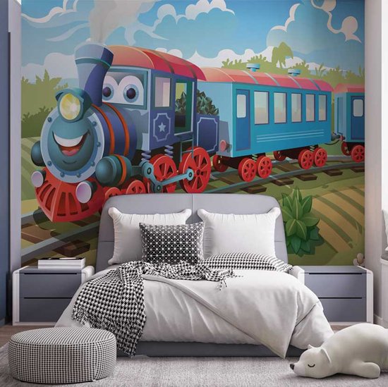 Vrolijke blauwe trein met rode accenten en een rode wagon op een spoor in een landelijke omgeving met wolken.