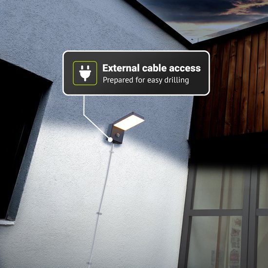 Zwarte wandlamp met sensor, met de tekst 'External cable access' en kabelgeleiding.