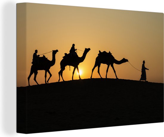 Canvas Schilderij Silhouet van kamelen in India - 120x80 cm - Wanddecoratie