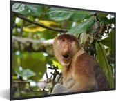 Photo encadrée - Un singe proboscis parmi les feuilles vertes cadre photo 40x30 cm - Affiche encadrée (Décoration murale salon / chambre)