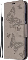 Mobigear Telefoonhoesje geschikt voor Huawei P40 Lite E Hoesje | Mobigear Butterfly Bookcase Portemonnee | Pasjeshouder voor 2 Pasjes | Telefoonhoesje voor Pinpas / OV Kaart / Rijbewijs - Grijs