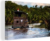 Canvas Schilderij Boot op een rivier in het Nationaal park Tanjung Putung in Indonesië - 90x60 cm - Wanddecoratie