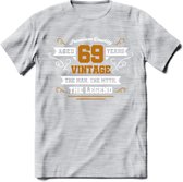 69 Jaar Legend T-Shirt | Goud - Wit | Grappig Verjaardag en Feest Cadeau Shirt | Dames - Heren - Unisex | Tshirt Kleding Kado | - Licht Grijs - Gemaleerd - M