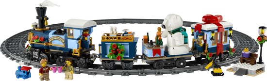 Gedetailleerde LEGO Icons Feestelijke Kersttrein in blauw met gouden details, wagons met cadeaus en een ijsbeer, op een cirkelvormig spoor.