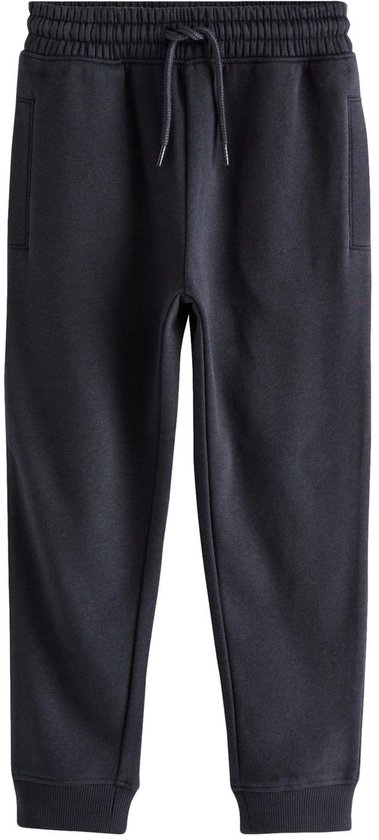 Donkerblauwe slim-fit joggingbroek met elastische tailleband, trekkoord en boorden aan de enkels.