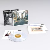 LP-hoes met straatbeeld, zwart-wit interieur en een doorschijnende vinylplaat met gitaren. Tekst: (What's The Story) Morning Glory?