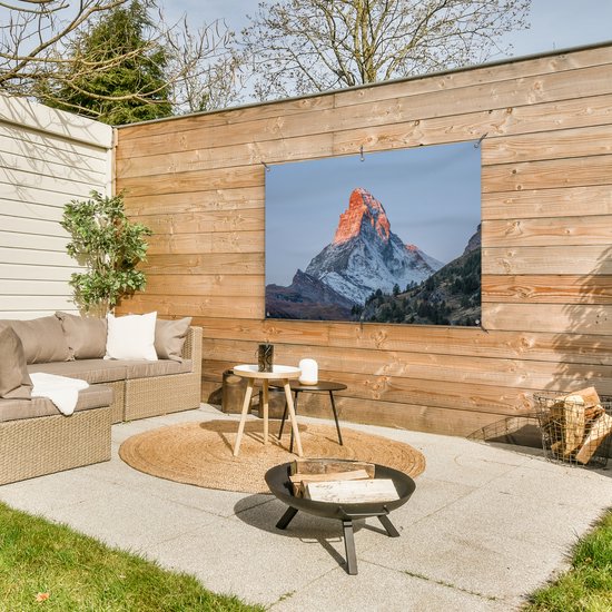 Tuinposter 120x80 cm - Tuindecoratie De Matterhorn in Zwitserland bij zonsopkomst - Poster voor in de tuin - Buiten decoratie - Schutting tuinschilderij - Tuindoek muurdecoratie - Wanddecoratie balkondoek