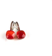 Zilveren oorringen oorbellen model pomellato gezet met fel oranje steen