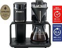 Zwart koffiezetapparaat met glazen kan, met keurmerken 'European Coffee Centre Approved' en 'Best Reviewed MEI 2021'.