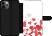 Bookcase Geschikt voor iPhone 11 Pro Max telefoonhoesje - Een illustratie van een regen van hartjes - Met vakjes - Wallet case met magneetsluiting