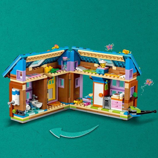 Binnenkant van een Lego Friends tiny house met keuken, badkamer en slaapkamer.