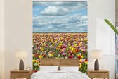 Behang - Fotobehang Tulpen - Kleuren - Wolken - Breedte 180 cm x hoogte 280 cm